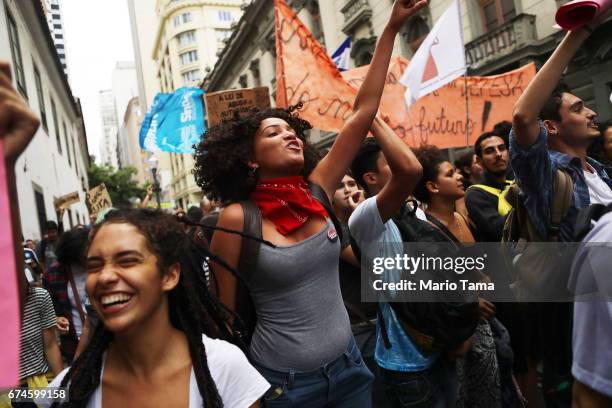 Protestors march at demonstrations during a nationwide general strike on April 28, 2017 in Rio de Janeiro, Brazil. The general strike was conducted...