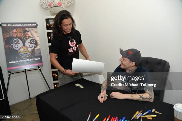 Electronic musician deadmau5 signs an autograph for a fan at deadmau5 and FANCY.com's pop-up shop "Lots Of Stuff In A Store" on April 28, 2017 in Los...