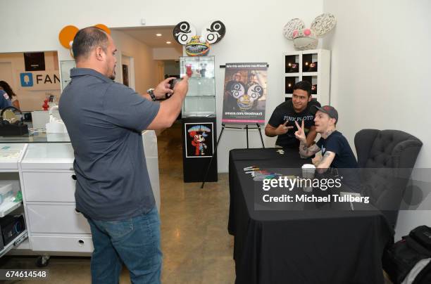Electronic musician deadmau5 signs an autograph for a fan at deadmau5 and FANCY.com's pop-up shop "Lots Of Stuff In A Store" on April 28, 2017 in Los...