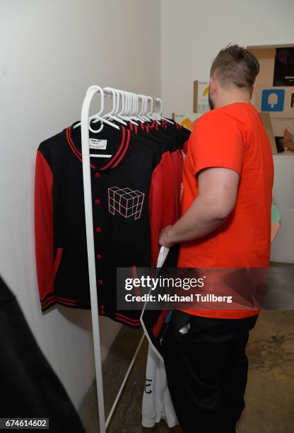 Fan examines some deadmau5 merchandise at electronic musician deadmau5 and FANCY.com's pop-up shop "Lots Of Stuff In A Store" on April 28, 2017 in...