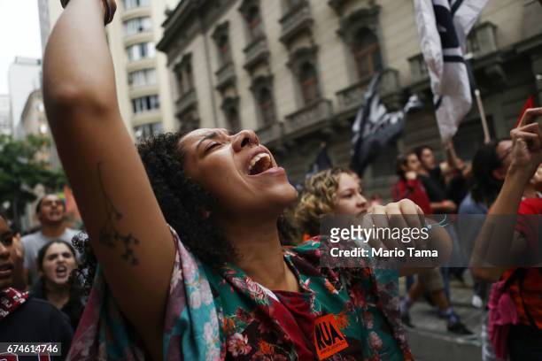 Protestors march at demonstrations during a nationwide general strike on April 28, 2017 in Rio de Janeiro, Brazil. The general strike was conducted...