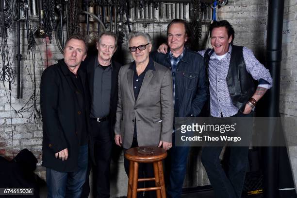 Actors Tim Roth, Steve Buscemi, Harvey Keitel, Quentin Tarantino and Michael Madsen pose for a "Reservoir Dogs" Cast Reunion Portrait with an empty...
