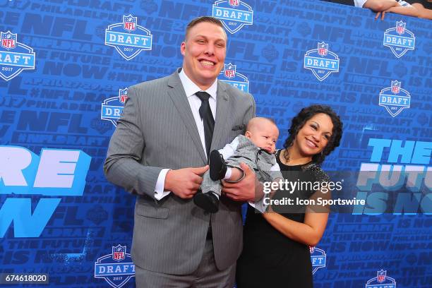 Garett Bolles from Utah along with his wife Natalie and their son Kingston on the Red Carpet outside of the NFL Draft Theater on April 27, 2017 in...