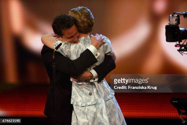 Alexander Fehling congratulates Sandra Hueller after she wins the Award for Best Actress at the Lola - German Film Award show at Messe Berlin on...