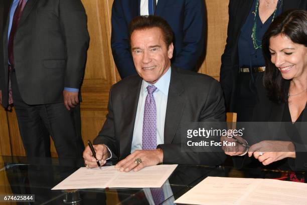 Arnold Schwazenegger and Mayor of Paris Anne Hidalgo attend Paris Mayor Anne Hidalgo Receives Arnold Schwarzenegger In Hotel de Ville de Paris on...