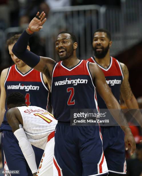 Guard John Wall of the Washington Wizards celebrates during Game Six of the Eastern Conference Quarterfinals against the Atlanta Hawks at Philips...