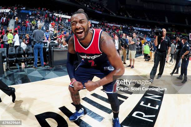 John Wall of the Washington Wizards smiles after the game against the Atlanta Hawks during Game Six of the Eastern Conference Quarterfinals of the...