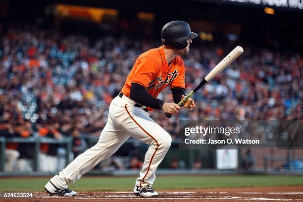 Conor Gillaspie of the San Francisco Giants hits an RBI single against the San Diego Padres during the first inning at AT&T Park on April 28, 2017 in...