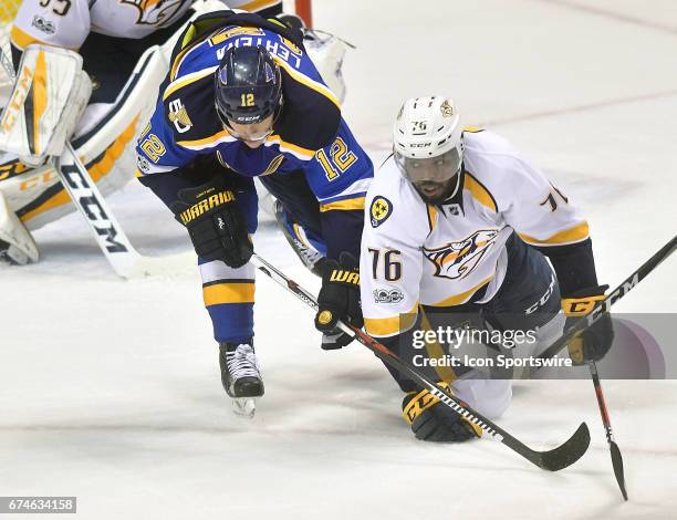 St. Louis Blues center Jori Lehtera and Nashville defensman P.K.Subban go after a loose puck in front of the Nashville net during game 1 of the...