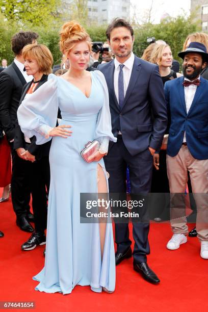 German presenter Palina Rojinski and german actor Simon Verhoeven during the Lola - German Film Award red carpet arrivals at Messe Berlin on April...