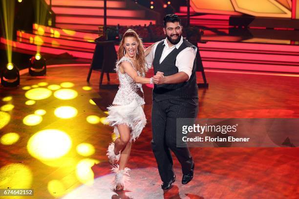 Faisal Kawusi and Oana Nechiti perform on stage during the 6th show of the tenth season of the television competition 'Let's Dance' on April 28, 2017...
