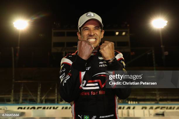 Helio Castroneves of Brazil, driver of the Team Penske Chevrolet celebrates after winning the Verizon P1 Pole Award for the Desert Diamond West...