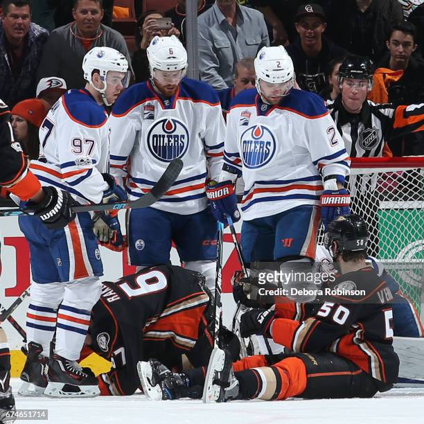 Connor McDavid, Adam Larsson and Andrej Sekera of the Edmonton Oilers look down at Rickard Rakell and Antoine Vermette of the Anaheim Ducks in Game...
