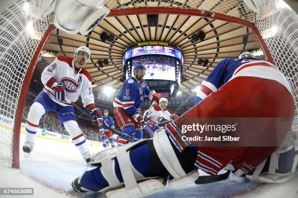 Tomas Plekanec of the Montreal Canadiens looks for a rebound at the net against the New York Rangers in Game Six of the Eastern Conference First...