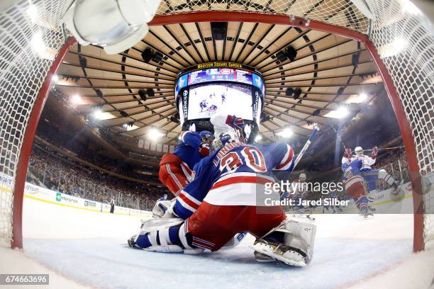 Henrik Lundqvist of the New York Rangers tends the net against the Montreal Canadiens in Game Six of the Eastern Conference First Round during the...