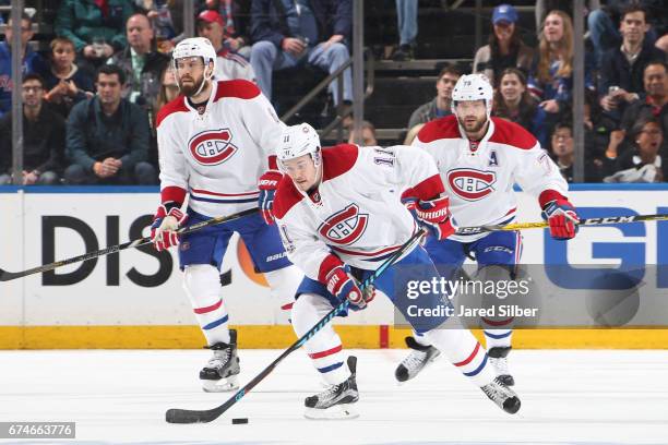 Brendan Gallagher of the Montreal Canadiens skates the puck up the ice against the New York Rangers in Game Six of the Eastern Conference First Round...