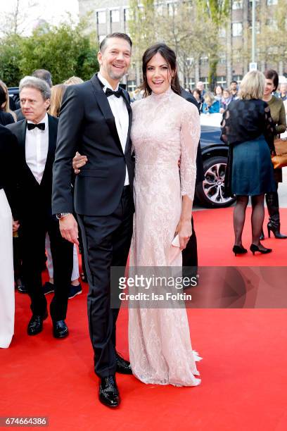 German actor Kai Wiesinger and his partner german actress Bettina Zimmermann during the Lola - German Film Award red carpet arrivals at Messe Berlin...