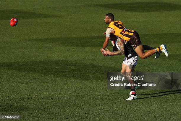 Josh Gibson of the Hawks challenges Tim Membrey of the Saints during the round six AFL match between the Hawthorn Hawks and the St Kilda Saints at...