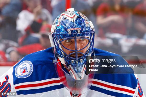 Henrik Lundqvist of the New York Rangers looks on during warmups prior to a game against the Ottawa Senators in Game One of the Eastern Conference...