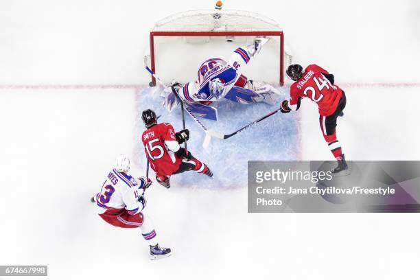 Zack Smith of the Ottawa Senators shot hits the post as Kevin Hayes and Henrik Lundqvist of the New York Rangers defend the net and Viktor Stalberg...