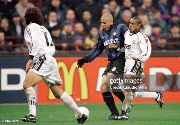 Ronaldo of Inter Milan and Clarence Seedorf of Real Madrid compete for the ball during the Champions League match between Inter Milan and Spartak...