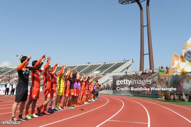 Ehime FC players applaud supporters after their 2-0 victory after the J.League J2 match between Ehime FC and Montedio Yamagata at Nigineer Stadium on...