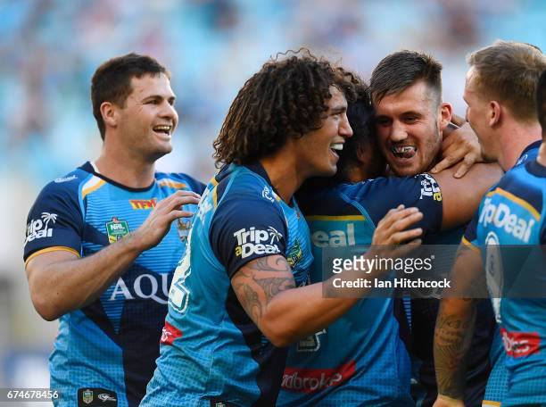Joe Greenwood of the Titans celebrates after scoring a try during the round nine NRL match between the Gold Coast Titans and the Newcastle Knights at...