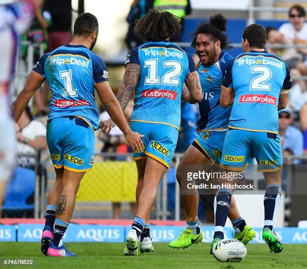 Konrad Hurrell of the Titans celebrates after scoring a try during the round nine NRL match between the Gold Coast Titans and the Newcastle Knights...