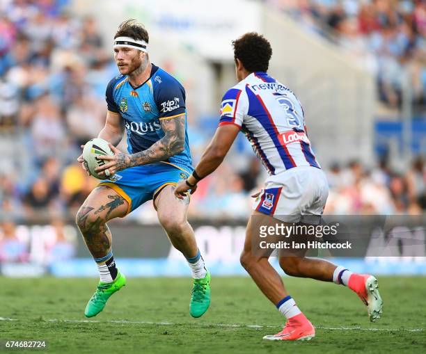 Chris McQueen of the Titans runs the ball during the round nine NRL match between the Gold Coast Titans and the Newcastle Knights at Cbus Super...