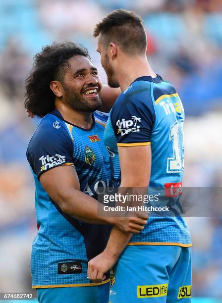 Konrad Hurrell of the Titans congratulates Joe Greenwood after he scored a try during the round nine NRL match between the Gold Coast Titans and the...