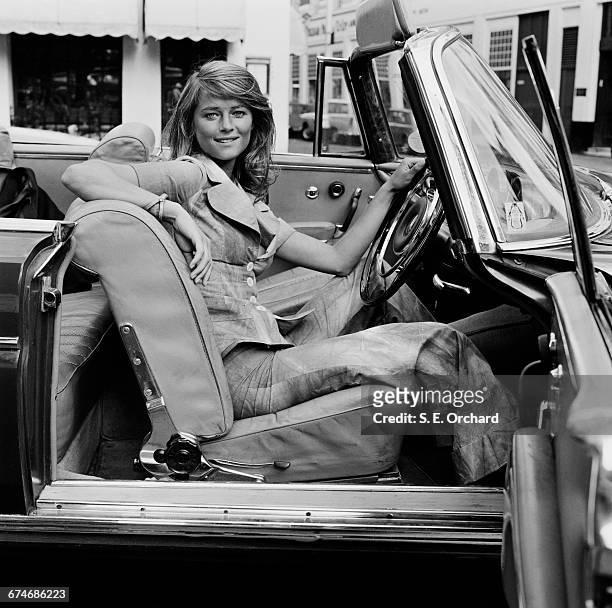 English actress Charlotte Rampling at the wheel of a convertible, UK, 27th August 1971.
