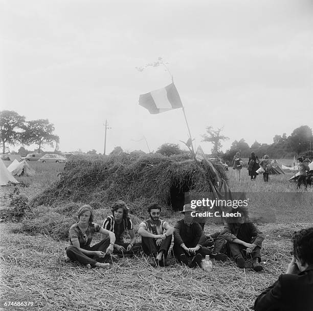 Fans waiting for the start of the Weeley Festival, a rock festival near Clacton in Essex, UK, 27th August 1971. From left to right, Tony Schaffer,...