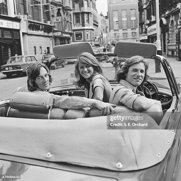 English actress Charlotte Rampling with actor and agent Bryan Southcombe and model Randall Laurence, UK, 27th August 1971. The three share a London...