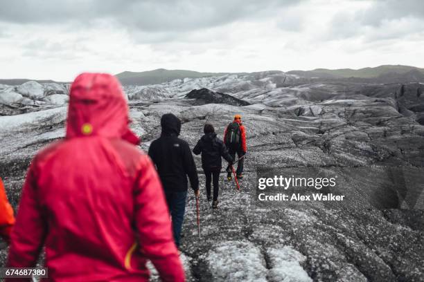 hiking group on svínafellsjökull glacier, iceland. - arctic explorer stock pictures, royalty-free photos & images