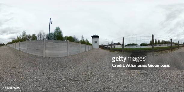 Panorama of Guard tower with a moat and barbed wire of the Dachau Arbeit concentration camp on April 14, 2017 in Dachau, Germany. Dachau was the...
