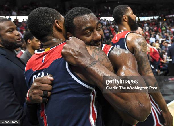 Washington Wizards guard John Wall hugs Washington Wizards guard Bradley Beal after the Wizards won Game Six of the NBA Playoffs First Round between...