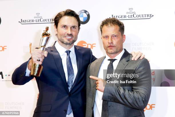 German actor and award winner for best film Simon Verhoeven and laudator and german actor Til Schweiger at the Lola - German Film Award winners board...