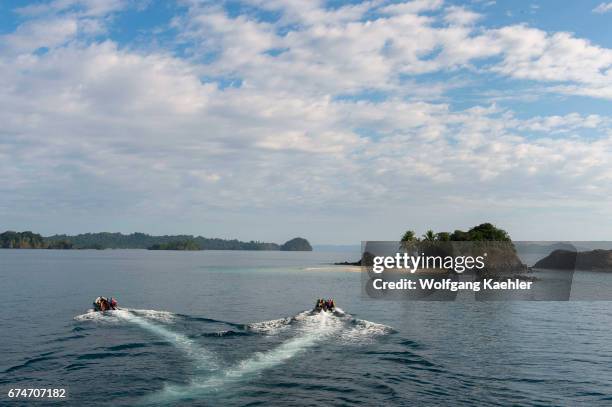 Zodiacs approaching the small island of Granito de Oro in Coiba National Park in Panama.