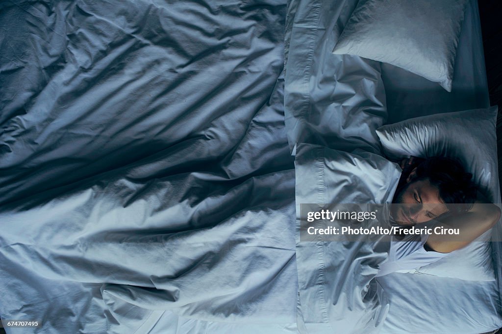 Man lying in bed