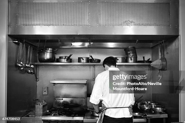 restaurant chef at work - stove extractor fan stock pictures, royalty-free photos & images