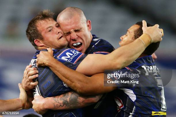 Josh Morris of the Bulldogs celebrates with David Klemmer of the Bulldogs after scoring a try during the round nine NRL match between the Canterbury...