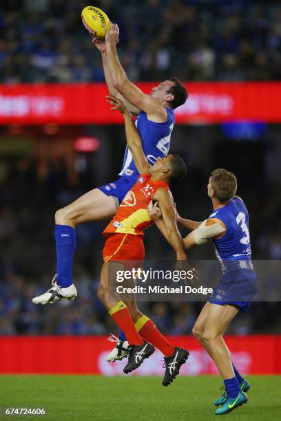 Todd Goldstein of the Kangaroos marks the ball against Touk Miller of the Suns during the round six AFL match between the North Melbourne Kangaroos...