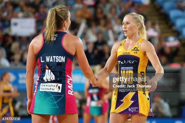 Liz Watson of the Melbourne Vixens and Laura Langman of the Lightning shake hanfs afrer the round 10 Super Netball match between the Vixens and the...