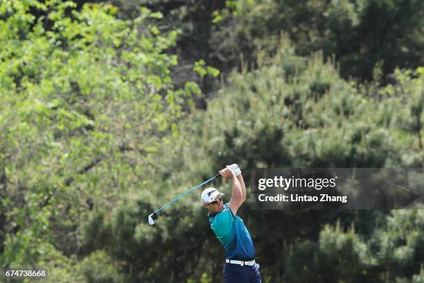 Jaco Van Zyl of South Africa plays a shot during the third round of the 2017 Volvo China open at Topwin Golf and Country Club on April 29, 2017 in...