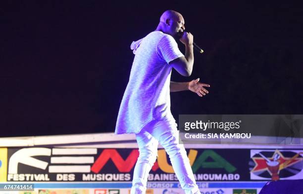 French singer Bedaya N'Garo Singuila aka Singuila , performs at the Festival des Musiques Urbaines d'Anoumabo on APril 29 at the Papa Wemba square in...