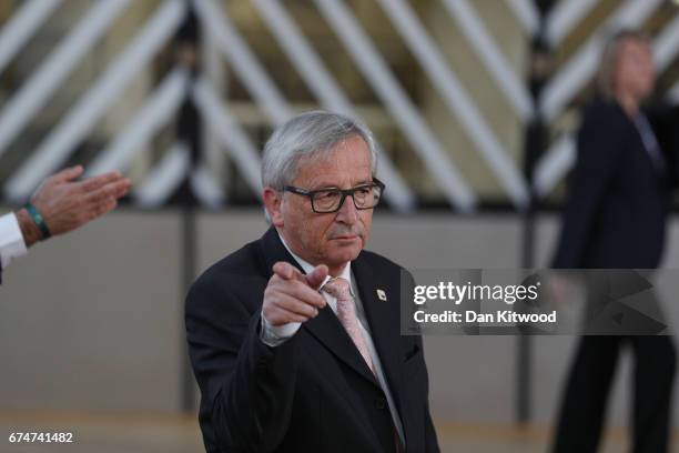 President of the European Commission Jean-Claude Juncker speaks to the media as he arrives at the Council of the European Union ahead of an EU...