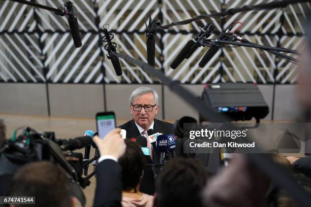 President of the European Commission Jean-Claude Juncker speaks to the media as he arrives at the Council of the European Union ahead of an EU...