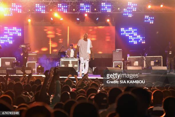 French singer Bedaya N'Garo Singuila aka Singuila, performs at the Festival des Musiques Urbaines d'Anoumabo on April 29 at the Papa Wemba square in...