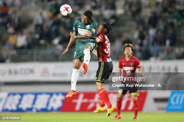 Henik of FC Gifu and Masato Yamazaki of Zweigen Kanagawa compete for the ball during the J.League J2 match between FC Gifu and Zweigen Kanazawa at...