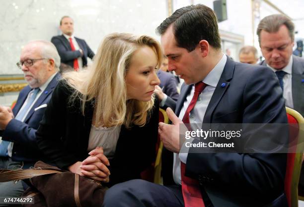 French far-right political party National Front deputy Marion Marechal-Le Pen speaks with General secretary of the far-right Front National party...
